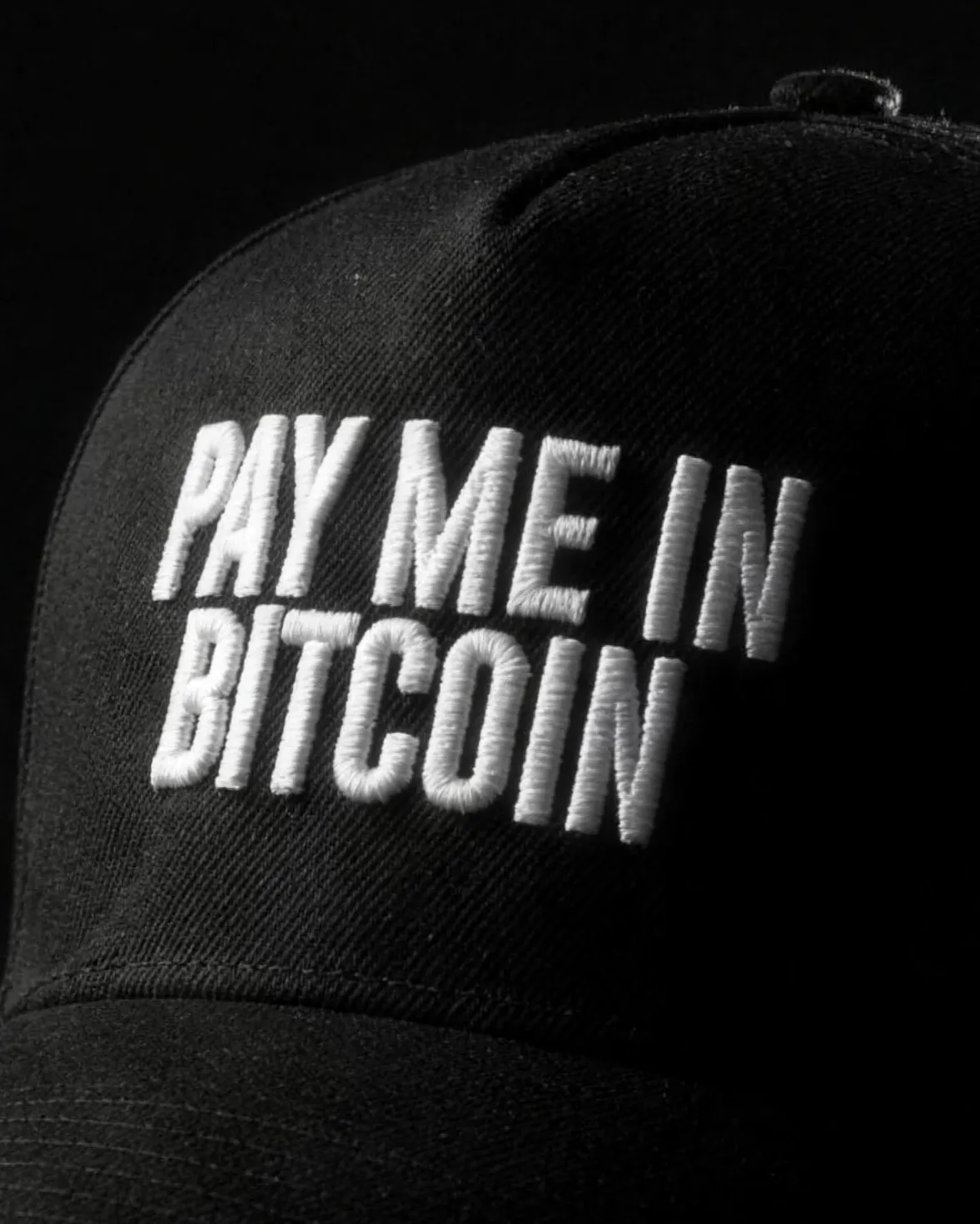 Macro of the white 3D embroidery on Pay Me In Bitcoin